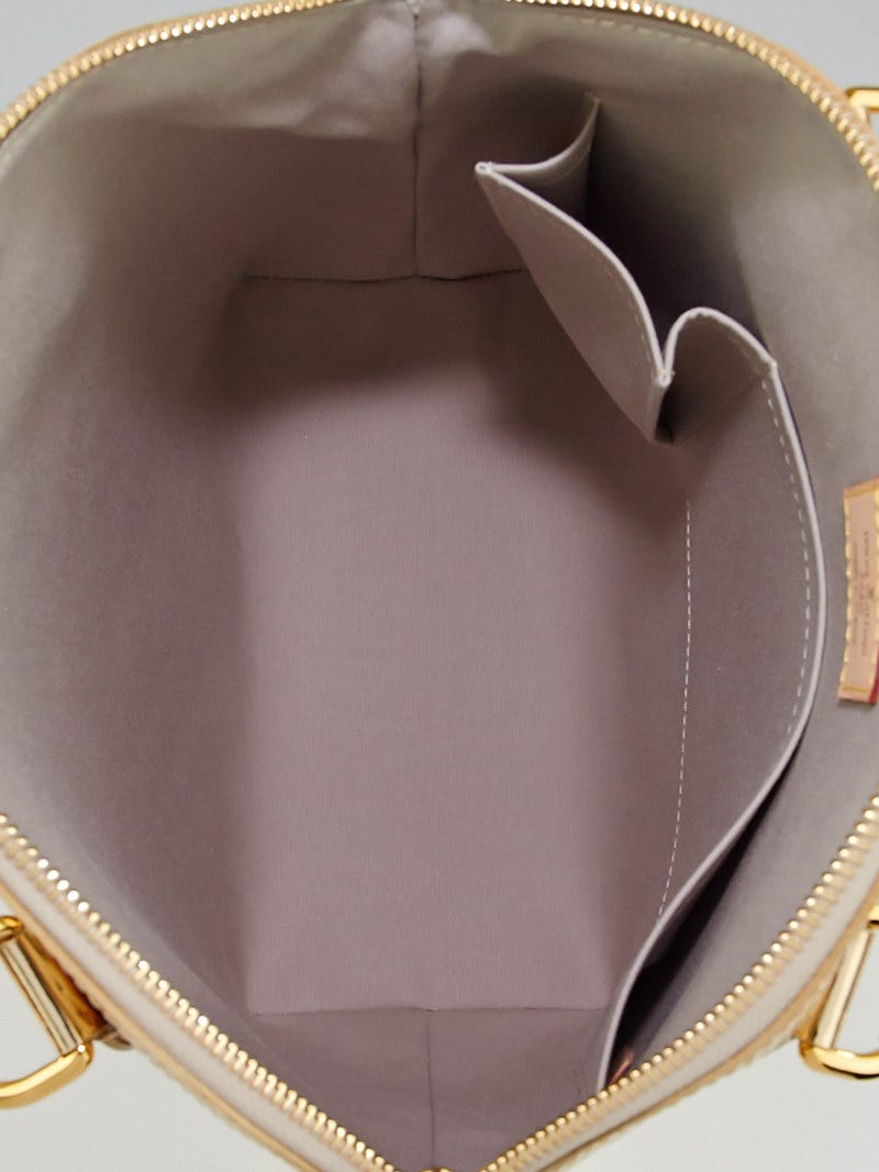 A Louis Vuitton Lockit Monogram Gold-Tone Mirrored Vinyl…