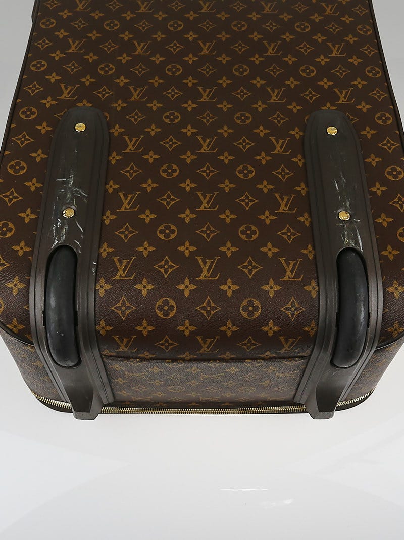 A Monogram Canvas Pégase 65 Suitcase with a Protective Cover