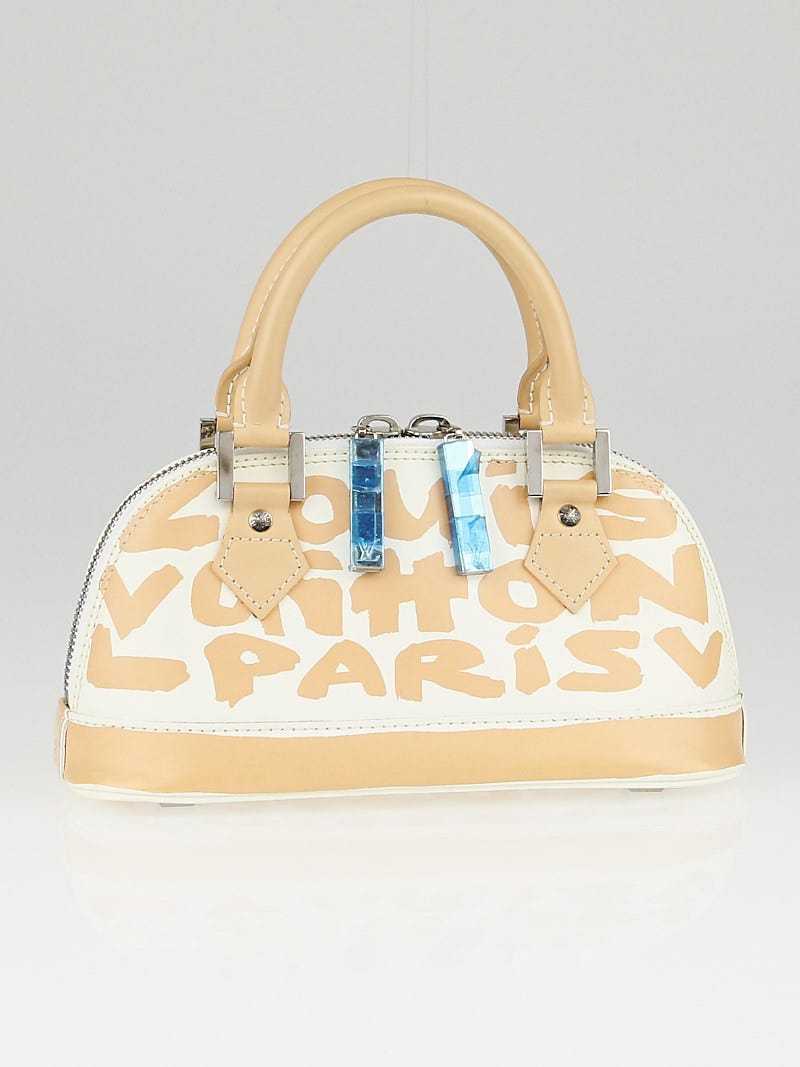 Alma graffiti leather handbag Louis Vuitton Beige in Leather