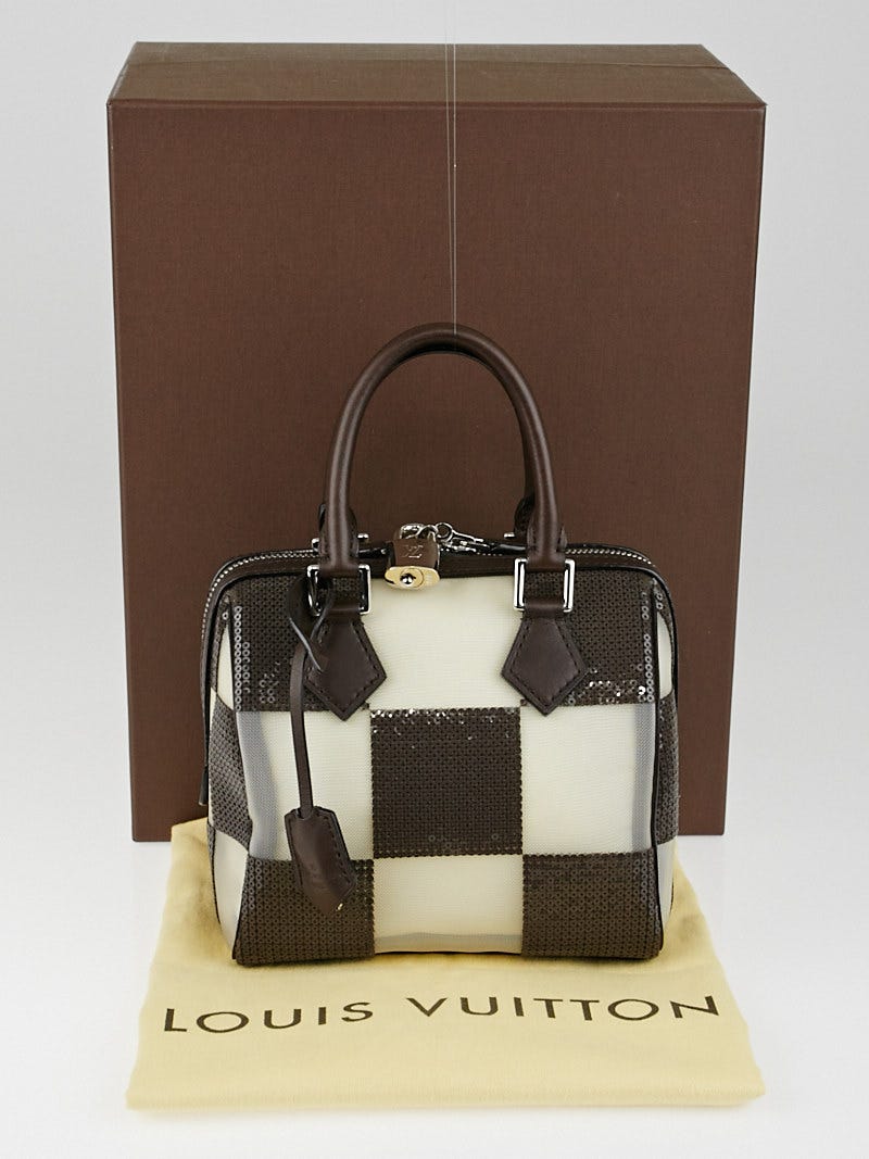 Authentic Louis Vuitton, metal cubes with certificate of authenticity and  box
