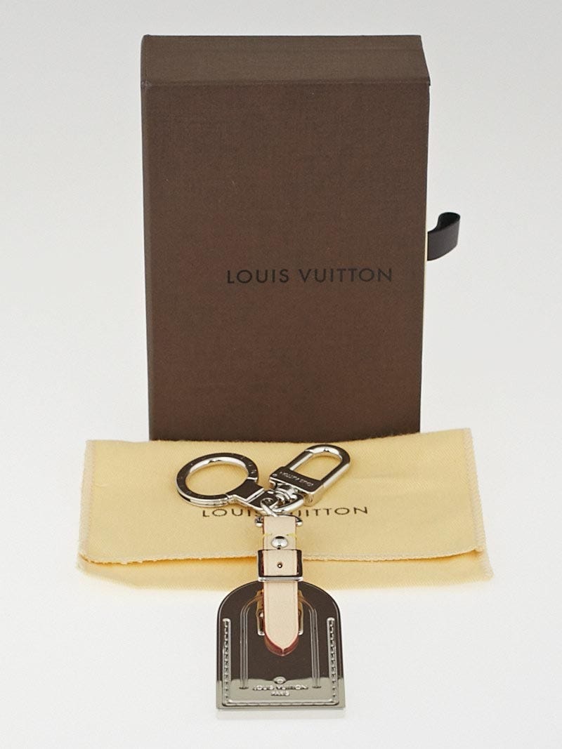 LOUIS VUITTON- Metal Luggage Tag Key Holder Silver/Key Ring. CONDITION:  Like NEW - FULL BOX - PRICE: R8500 @_ygs.luxury.preloved_