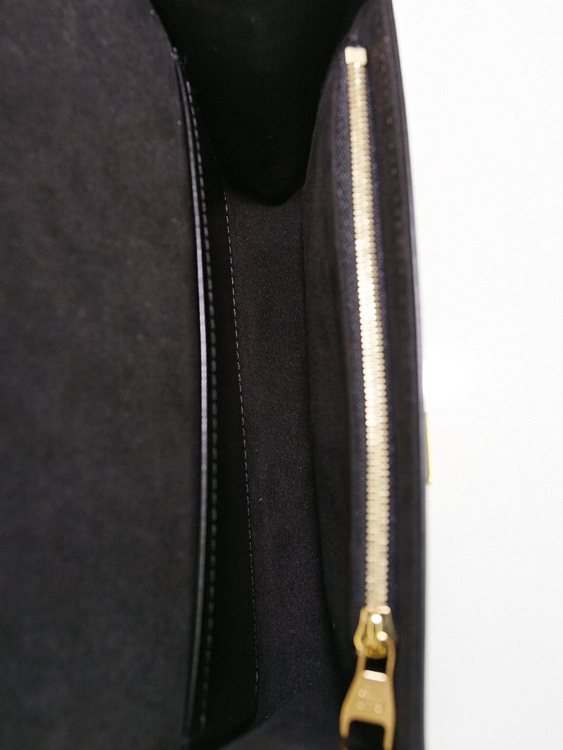 LOUIS VUITTON, a black leather ' Chain Louise MM' bag, 2015. - Bukowskis