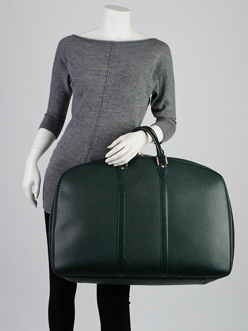 Charming Louis Vuitton Helanga travel bag in green taiga leather