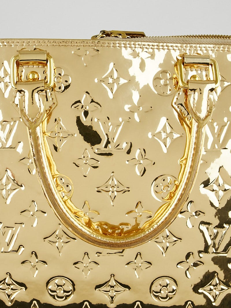A LIMITED EDITION GOLD MONOGRAM MIROIR ALMA MM WITH GOLD HARDWARE, LOUIS  VUITTON, 2008