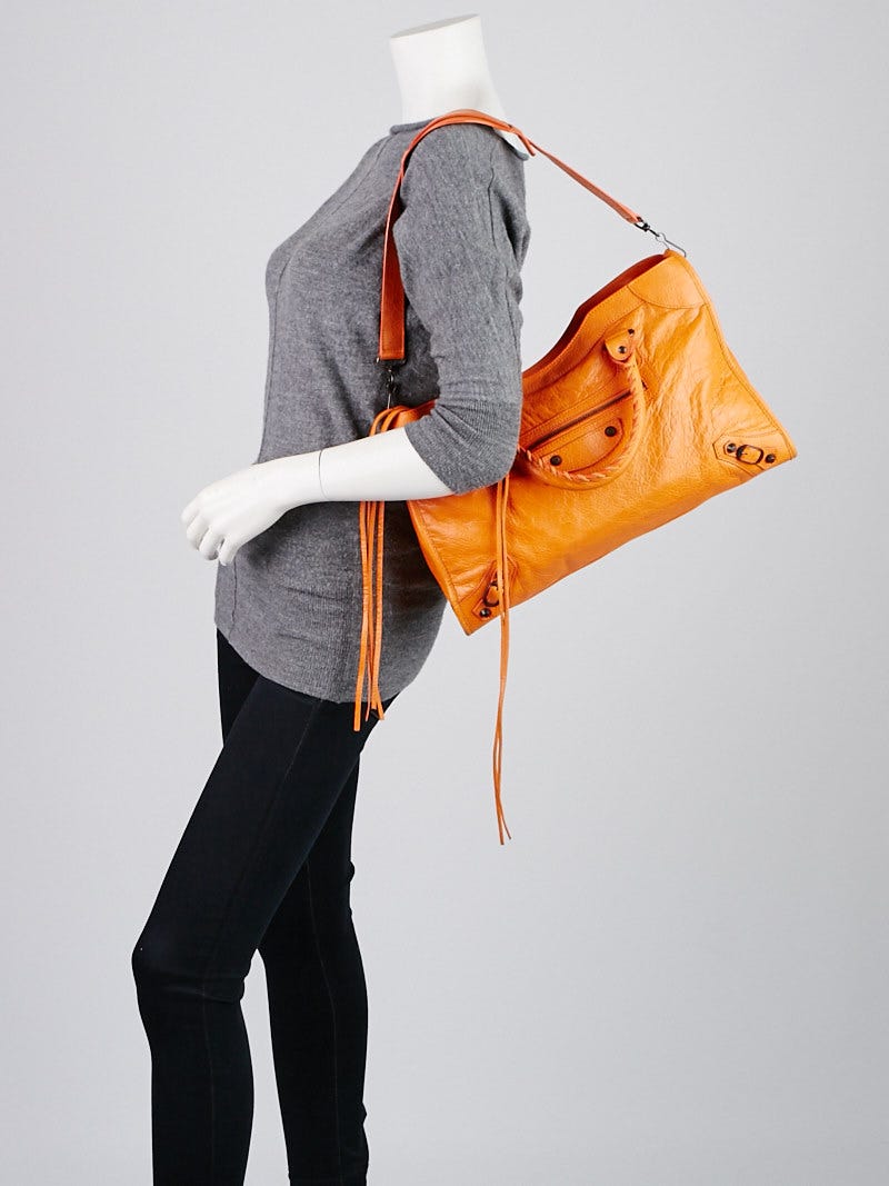 BALENCIAGA Women's City Bag Leather in Orange | Second Hand