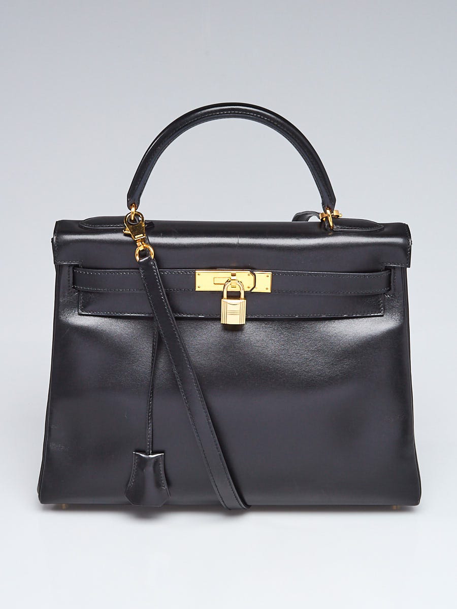 Kelly bag Black leather box (Worn)