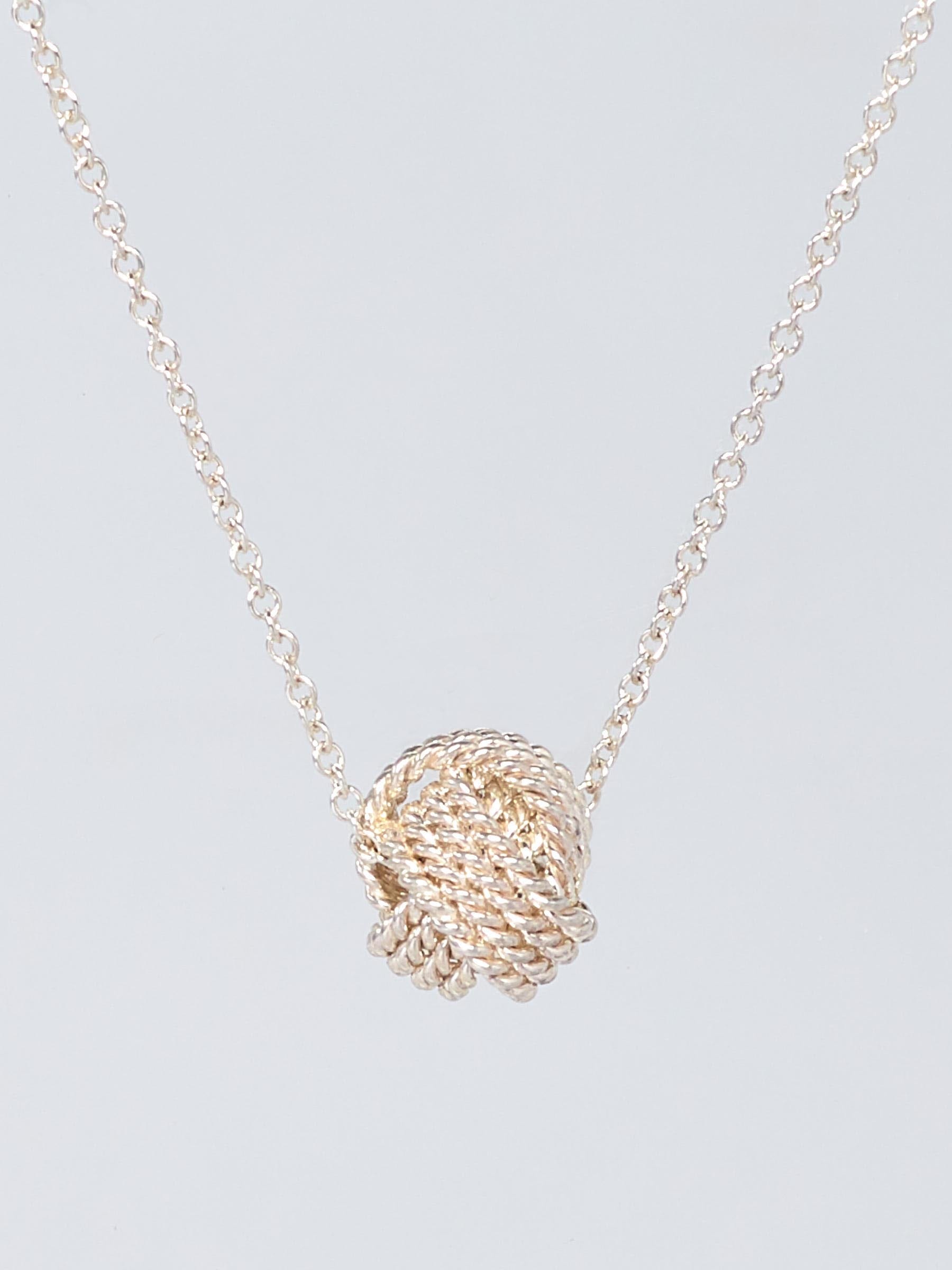 Tiffany and Co. Twist Knot Pendant on Mercari | Twist knot, Drawstring  pouch, Pendant