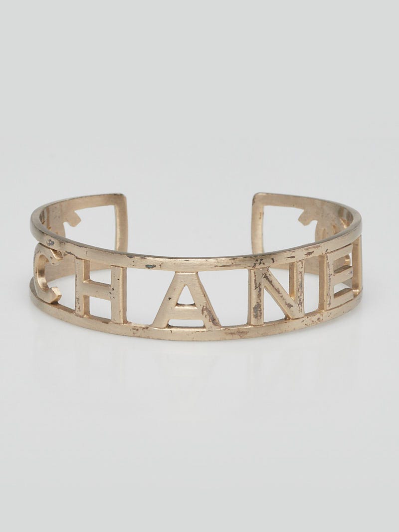 Chanel Goldtone Brushed Metal Logo Cuff Bracelet - Yoogi's Closet