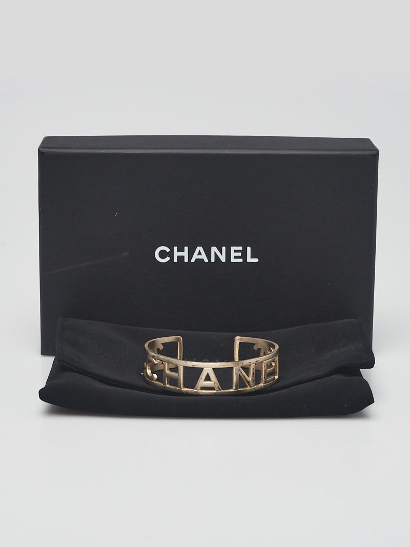 Chanel Goldtone Brushed Metal Logo Cuff Bracelet - Yoogi's Closet