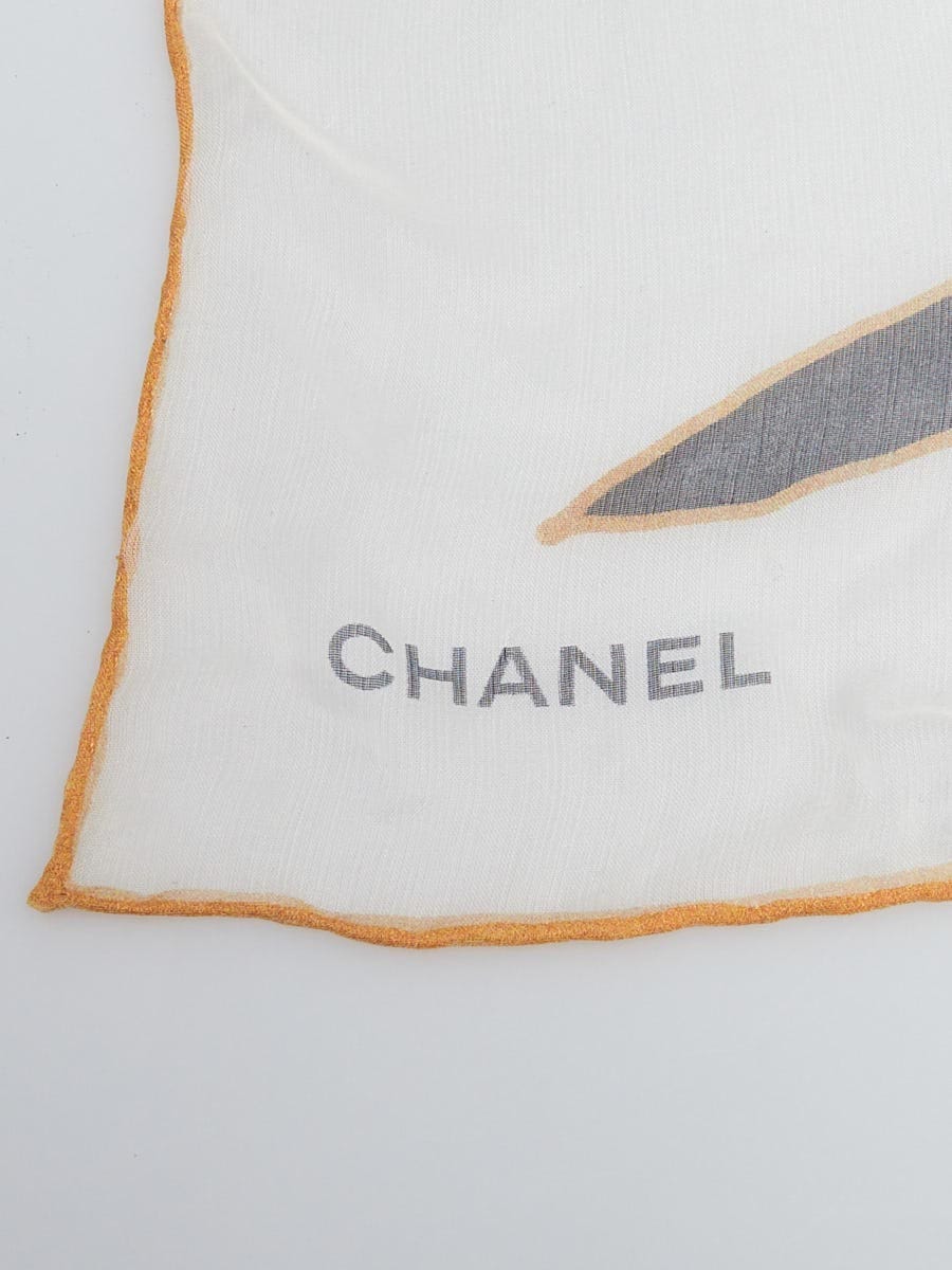 CHANEL Patterned silk scarf in shades of white, black an…