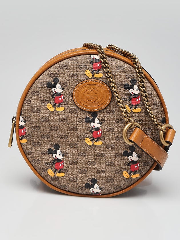 gucci mini backpack mickey mouse Micro GG Supreme Disney PVC Beige 603730 Auth 146074SM trimmed with light brown leather details that convey a vintage look and feel Gucci Disney Mickey Mouse Backpack