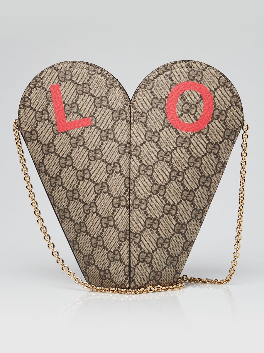 LOT:244 | GUCCI - a Lovely Heart crossbody hobo handbag.