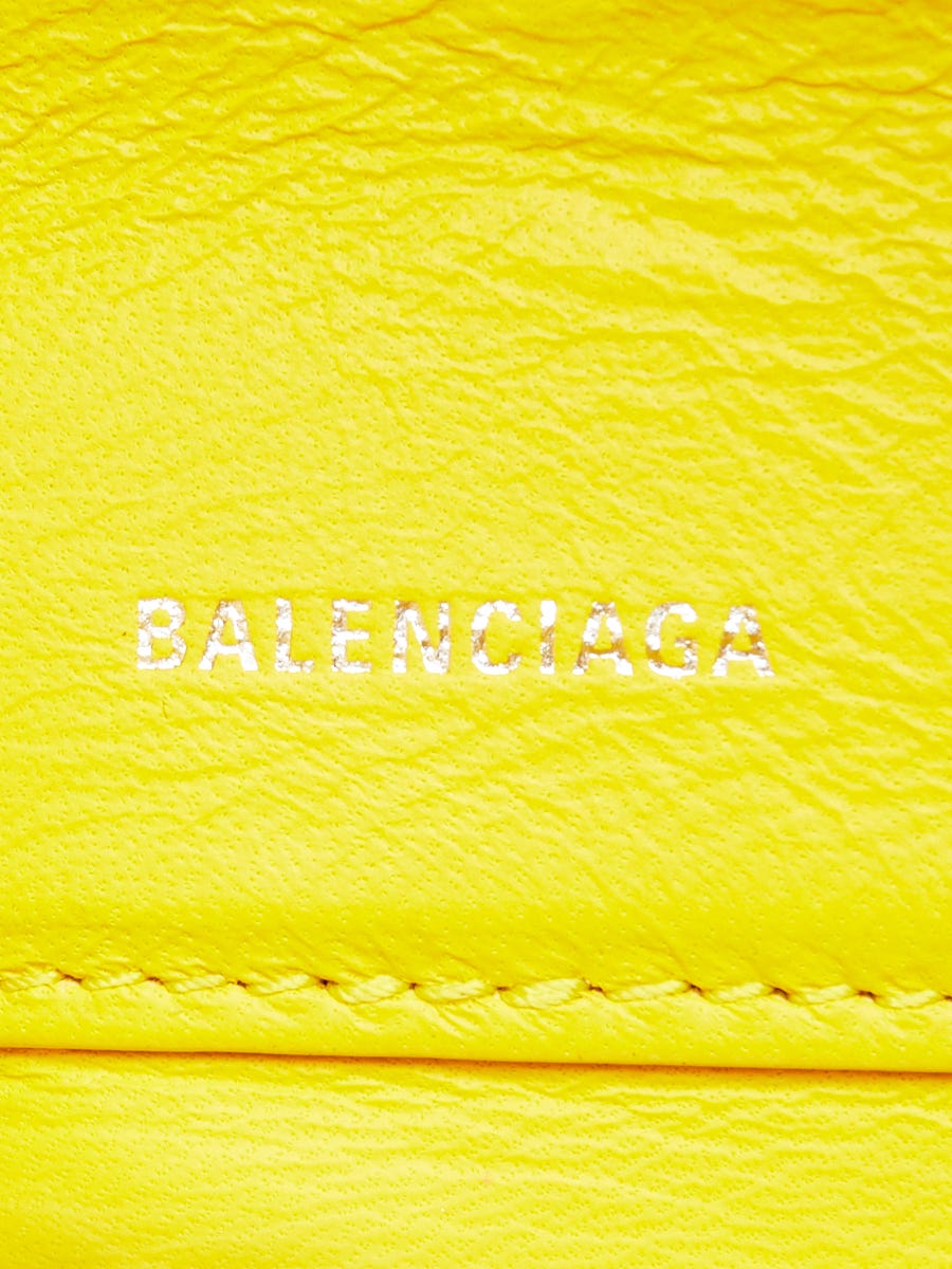 Balenciaga yellow triangle store clutch