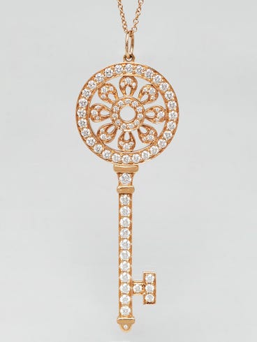 Tiffany
Co. 18k Yellow Gold and Diamond Tiffany Petals Key Pendant Necklace