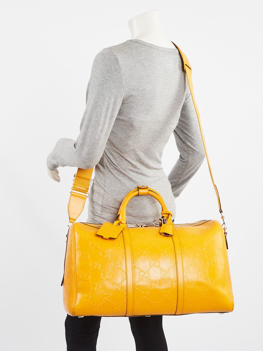 Gucci Yellow GG Perforated Leather Weekender Duffle Bag